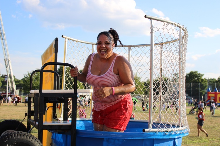 Clover Family Resource Coordinator, Ms. Figueroa joining in on the festivities in the dunk tank